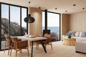 A modern living room featuring stamped concrete flooring and a panoramic view of the ocean through large windows.
