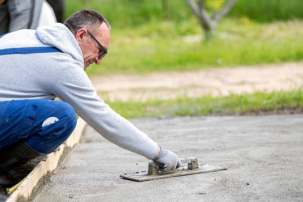 professional concrete contractors working on driveway