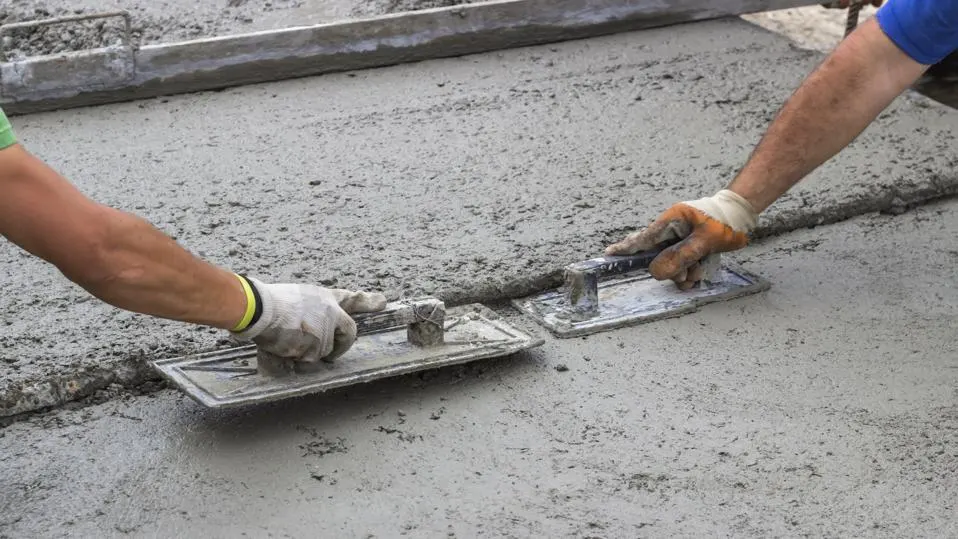 Residential vs Commercial Concrete Contractors working on driveway and parking lot projects